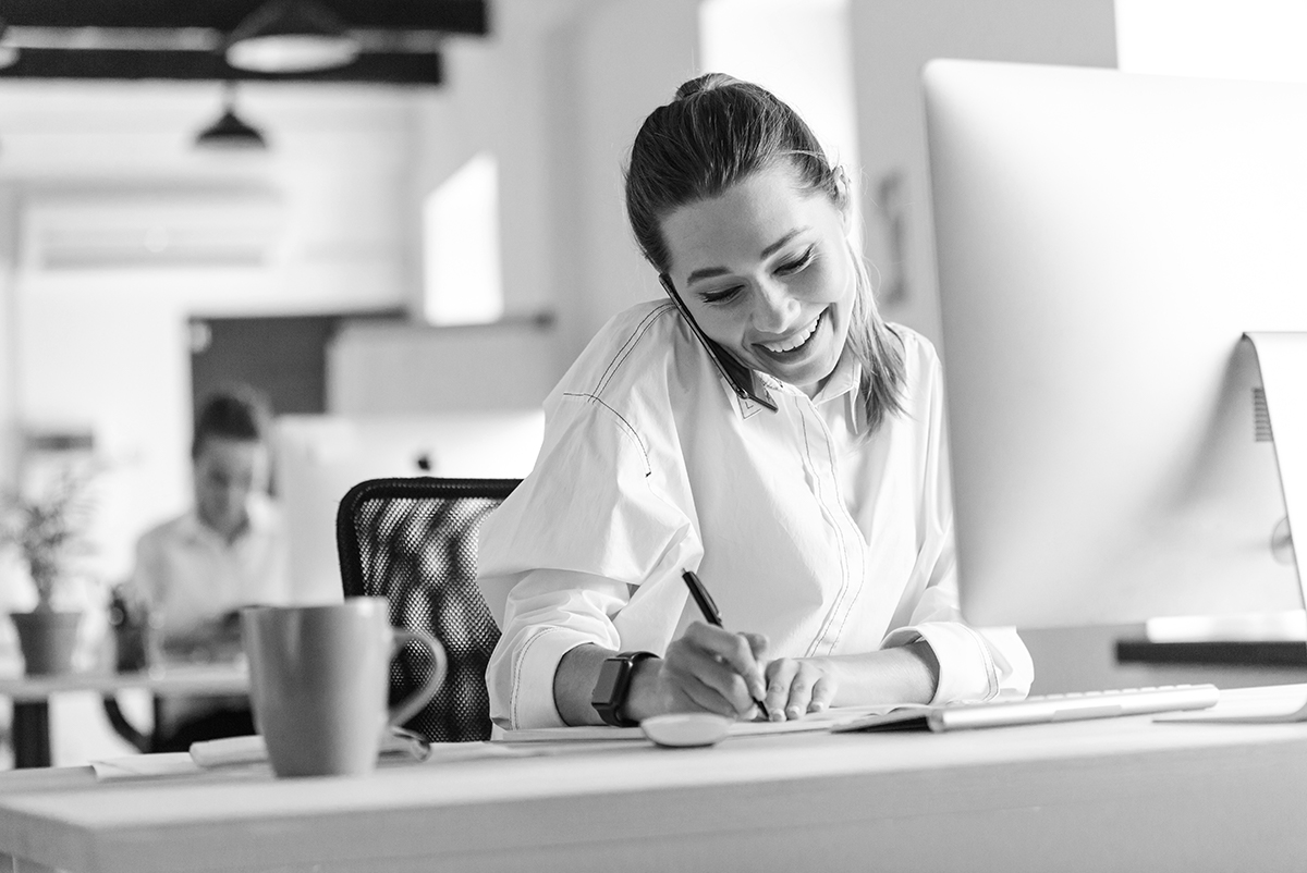 Woman on phone while working