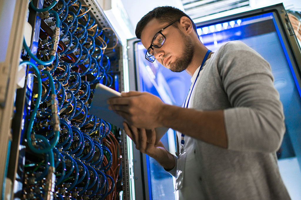 IT professional working in server room